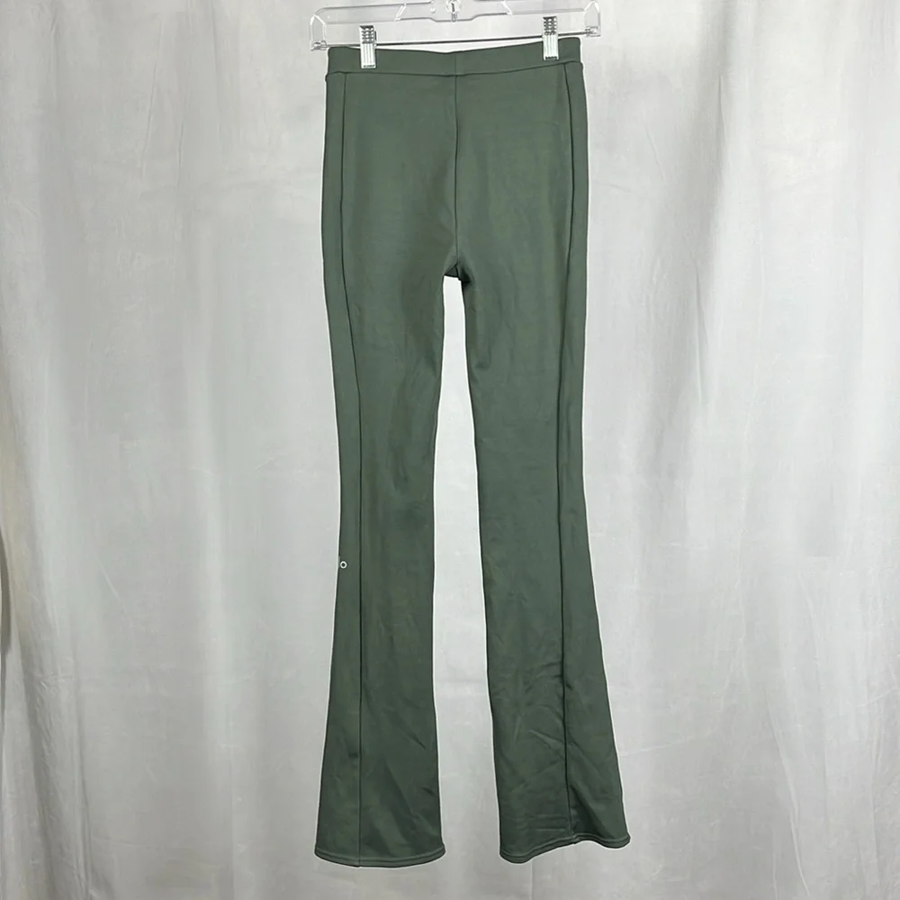 Alo‎ Yoga High-Waist Zip it Flare Legging in Dark Cactus Green.